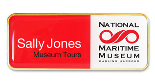A plastic executive name badge with the leyend: "Sally Jones"
